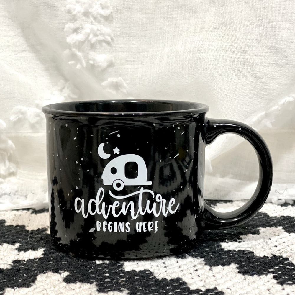 Adventure begins here black ceramic speckled mug